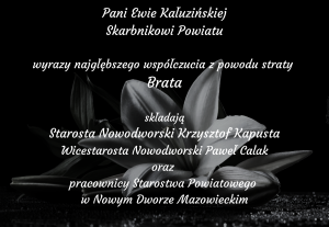 czarne tło, w tle lilia, białe napisy